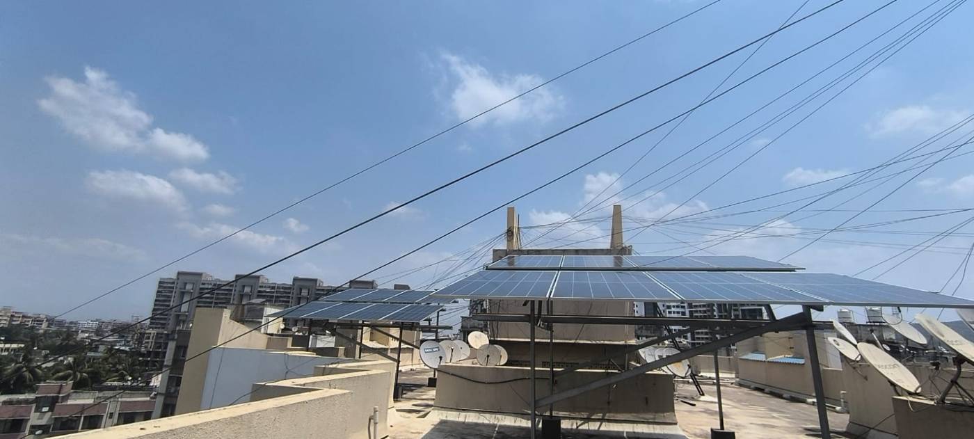 Rooftop solar installation with city skyline